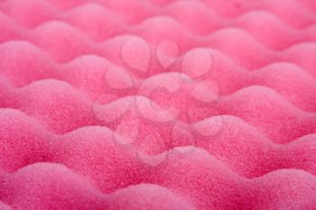 Close-up of pink cleaning sponge. Perspective view