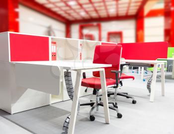 Office worker's place with modern interior in red tones