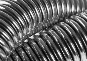 Close-up of coiled metal springs. In B/W