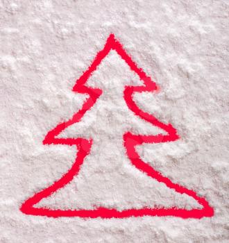 Christmas tree symbol on snow
