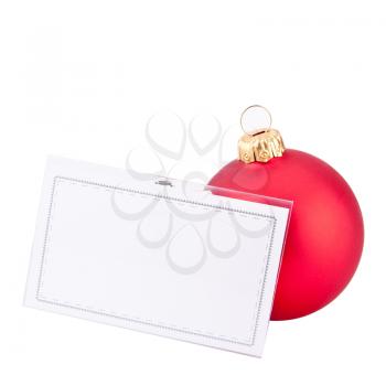 Christmas red bauble and blank business card. Isolated