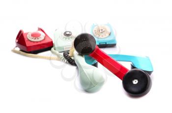 Set of vintage telephones with twisted handsets