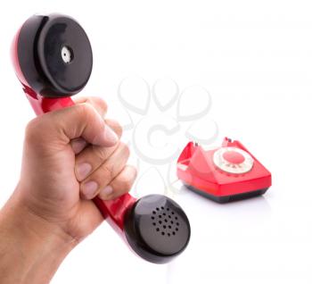 Macro of handset in hand of red telephone