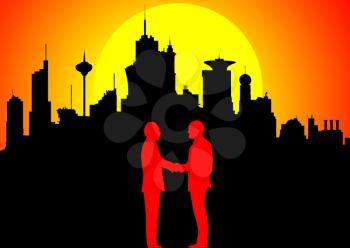 Silhouette of handshaking businessmen against downtown at sunset