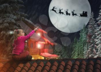 Girl sits on the roof in The Christmas eve