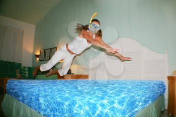 Snorkel woman jumping to bed