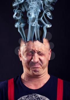 Stressed man with exploded head