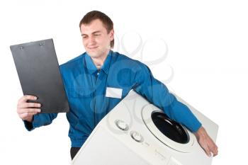 Repairman servicing washing machine. Isolated on white