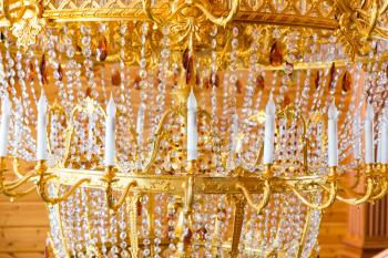 Close up of modern gilded chandelier