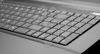 Close-up of modern laptop keyboard. In B/W
