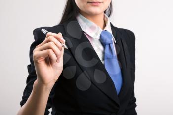 Young caucasian businesswoman ready to sign document