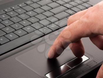 Hand working on a computer touchpad