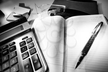 Business desktop. Business diary, calculator and pen