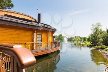 Wooden house stands on the beautiful lake