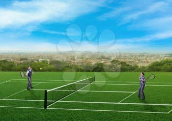 Businessman and businesswoman playing tennis
