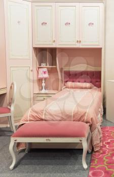 Child bedroom in pastel white and pink colors