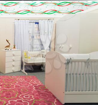 Baby room in pastel white and pink colors