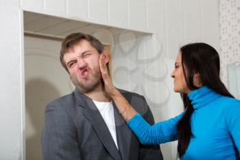Female slap her partner in living room