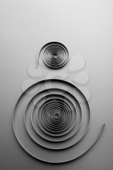 Two abstract metallic spirals on grey background