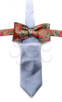 Grey necktie and red bow tie on a white background