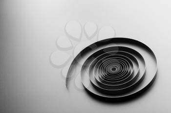 Abstract metallic spiral on grey background