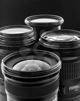 Four digital camera lenses. Closeup view