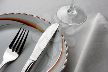 Dinner set. Fork and knife on plate