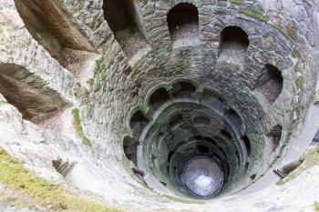 Up view of ancient tower with spiral staircase outdoor 