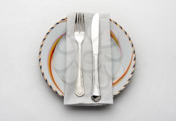 Dinner set. Fork and knife on plate