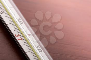 Thermometer on a wooden table