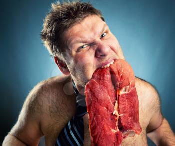 Crazy businessman with meat closeup