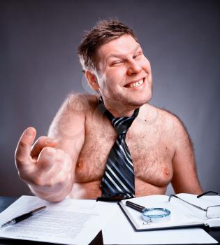 Freak shirtless manager working and make face