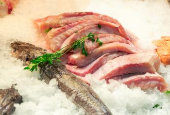 Fillet of fish on ice in seafood market