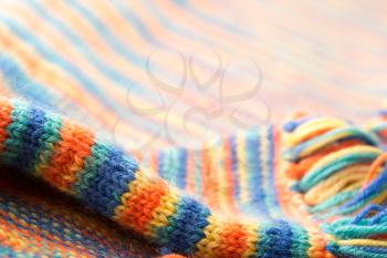 Knitted multicolored scarf with fringes
