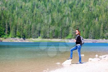 Traveler with backpack on the lake, Durmitor National Park, Montenegro