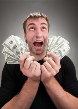 Portrait of very excited man with money