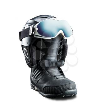 Snowboard boot with helmet and goggles isolated on white background