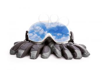 Winter sport glasses and gloves isolated on white background