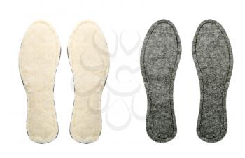 Two pairs of new insoles for shoes isolated on a white background