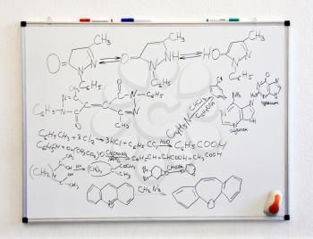 Chemistry science formulas on white board