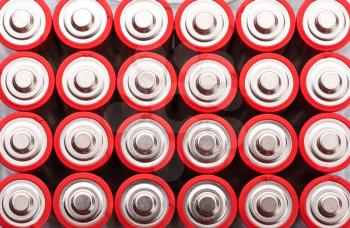 Background of red AA batteries