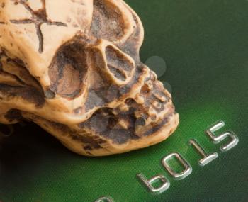 Bankruptcy concept. Human skull on credit card