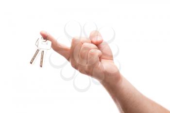 Hanging keys on a finger isolate on white