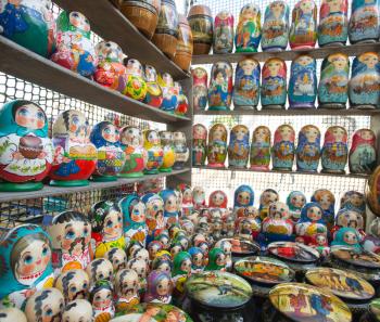 Many colorful russian dolls in a rows