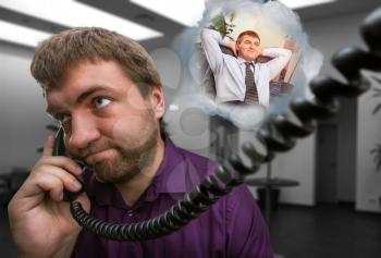 Sad man speaks on the phone dreaming aboute new job