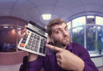 Accountant points to a calculator with a big total