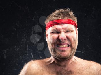 Angry man with red headband