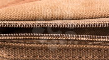 Macro view of brown bag with open zipper