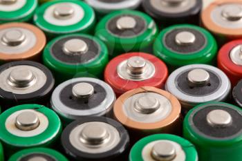 Many colorful batteries in a rows