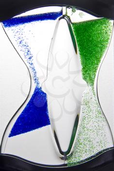 Liquid blue and green hourglass